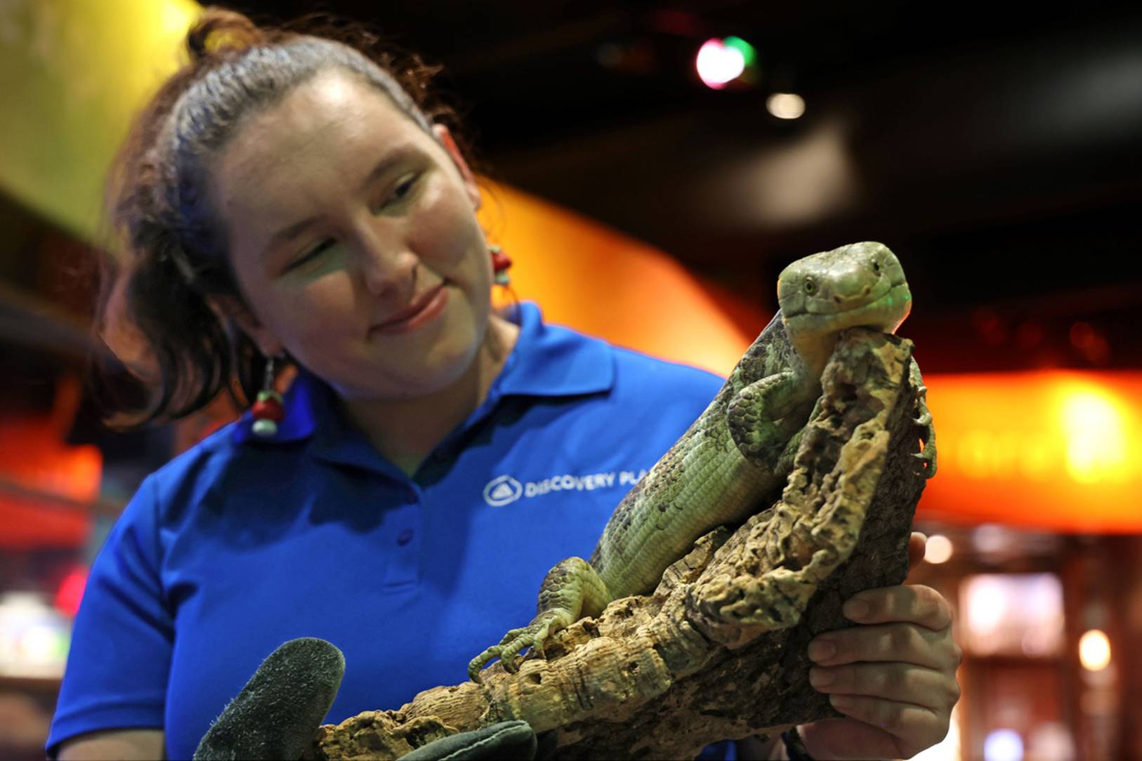 Discovery Place staff with lizard